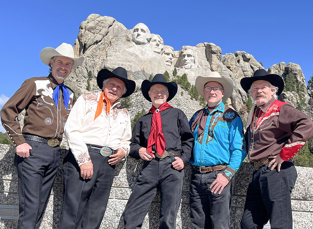 The Sons of the Pioneers posing in front of Mount Rushmore