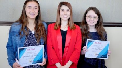 Scholorship recipients holding certificates