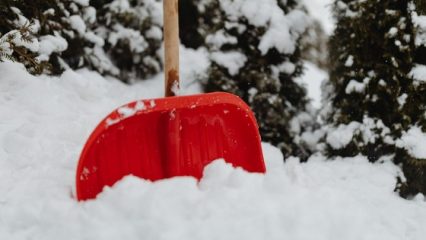 A snow shoveled buried in the snow