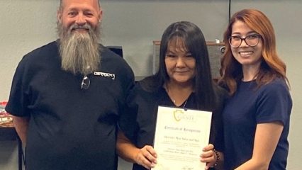 Kimberly Mesen with owners of Derrick's Hair Salon