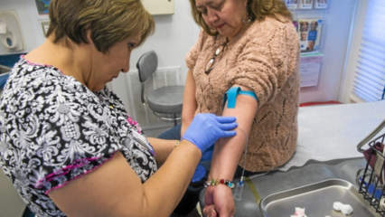 A woman having her blood drawn