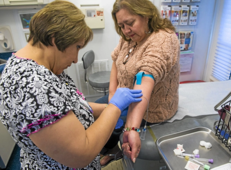 A woman having her blood drawn