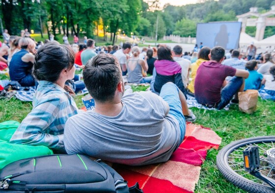 People in a park watching a movie