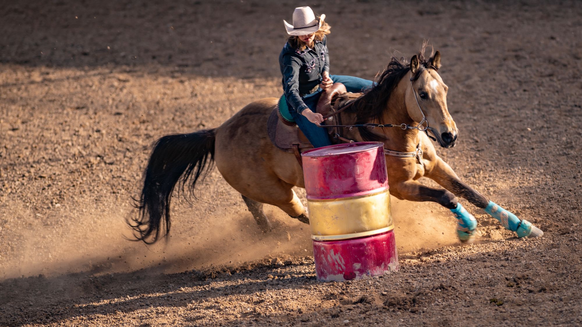 Photo of horse barrell racing to illustrate Sheriff's Rodeo.