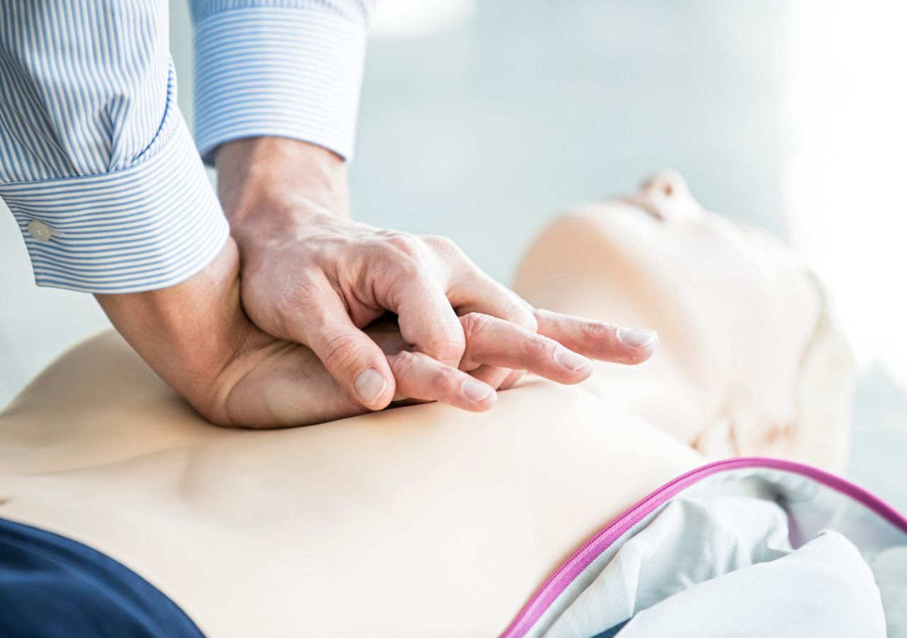 Photo of hands on a CPR doll