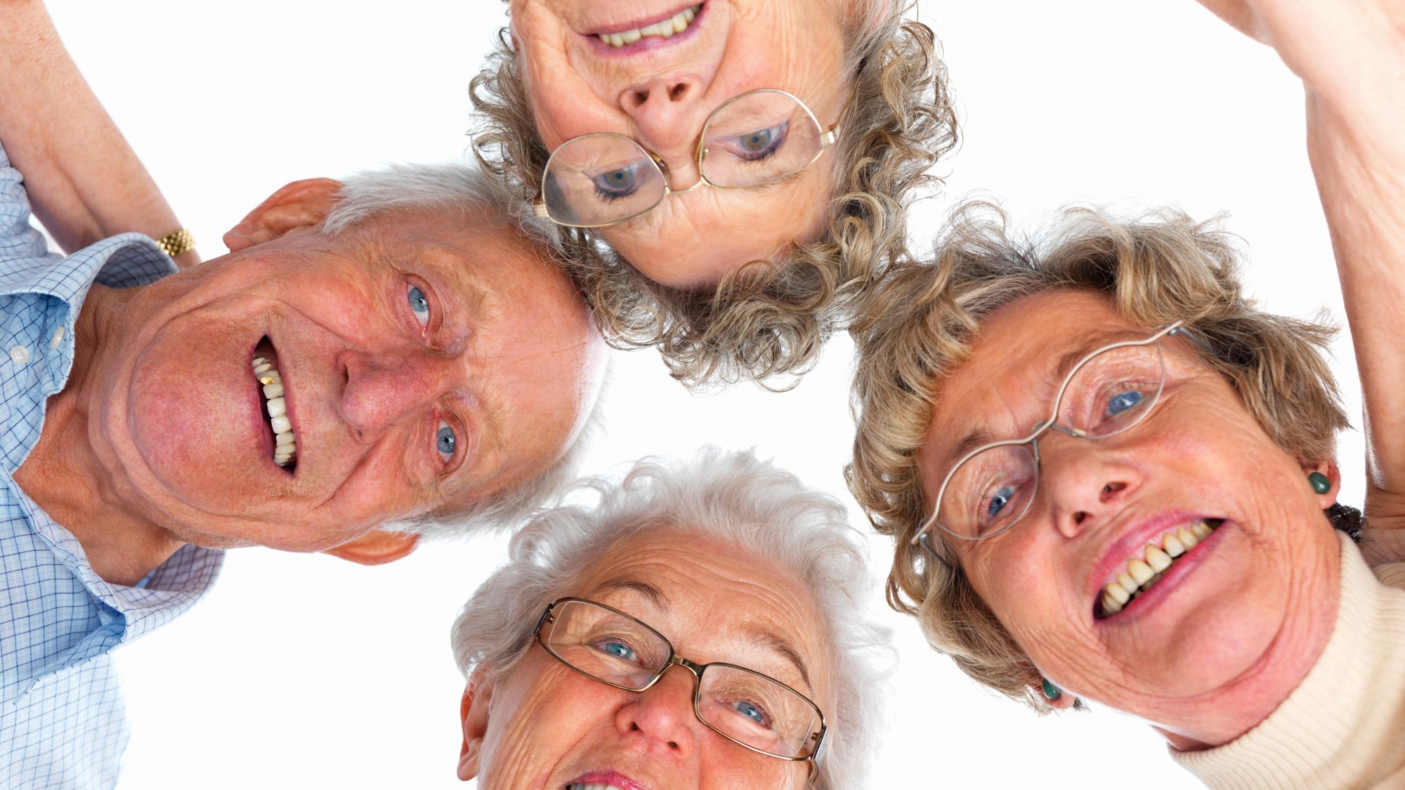 Photo of four seniors looking down at the camera