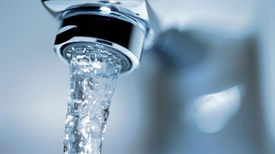 Water pouring from a faucet