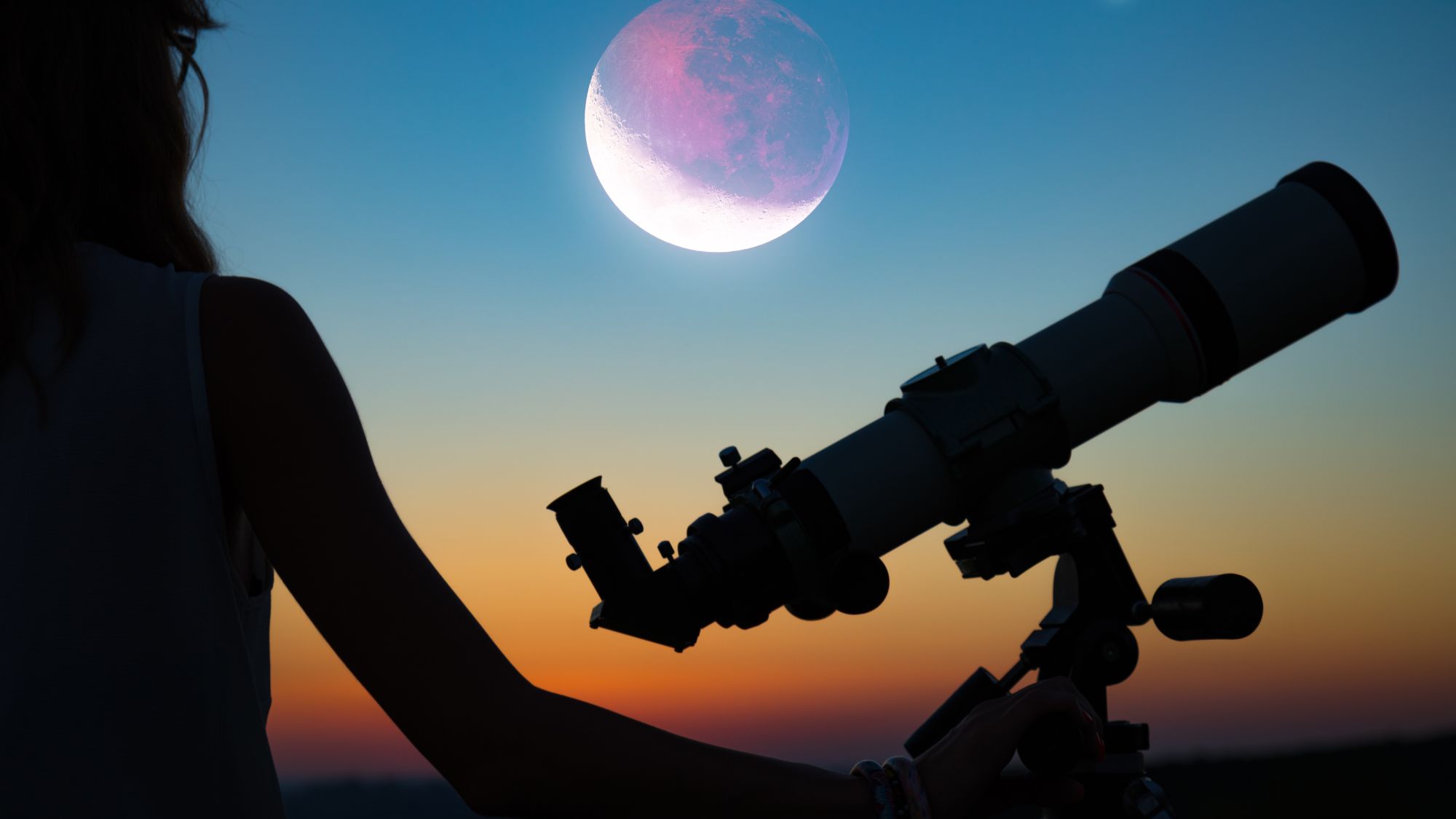 Telescope of woman with moon