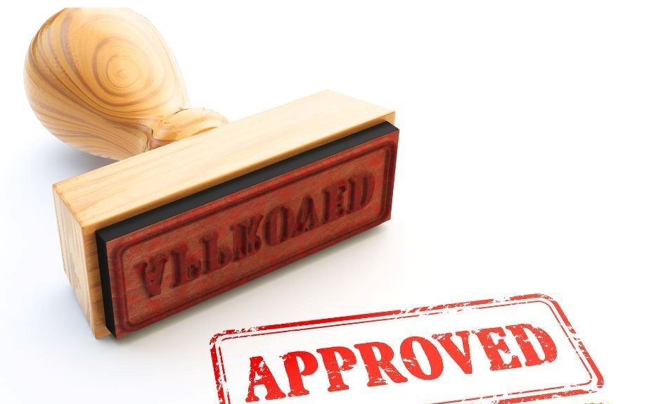 rubber stamp that reads "approved"