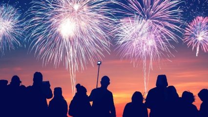photo of group of people enjoying fireworks display