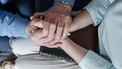 two people holding hands