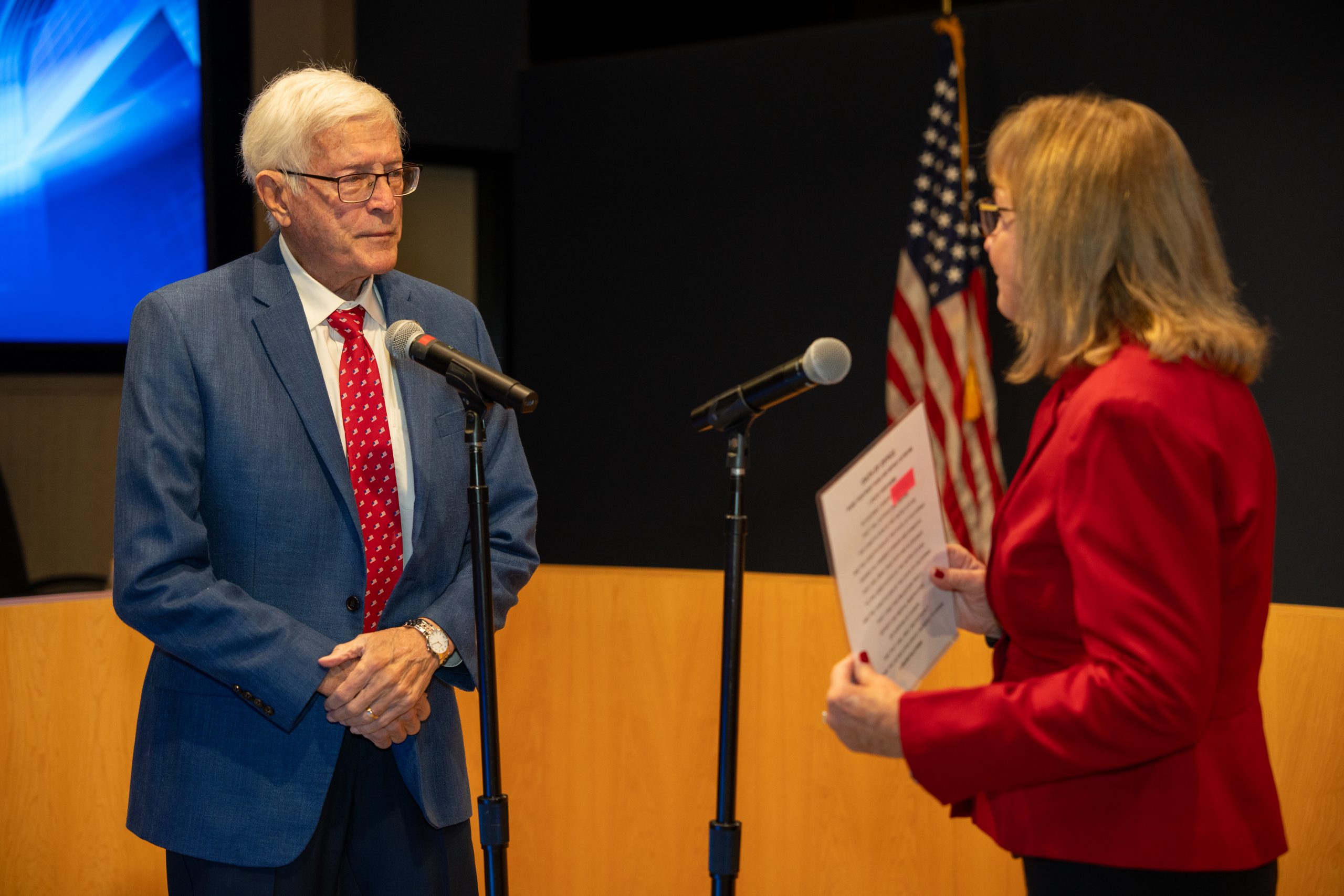 Paul Cook being sworn in by wife Jeanne.