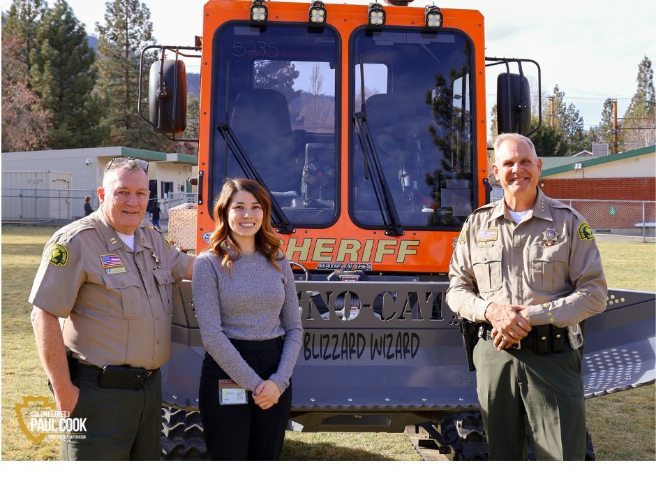 Captain Lutz, Kimberly Mesen and Sheriff Dicus with new snow cat.