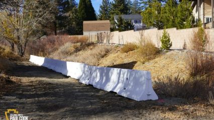 K-rail barrier in a Wrightwood yard.