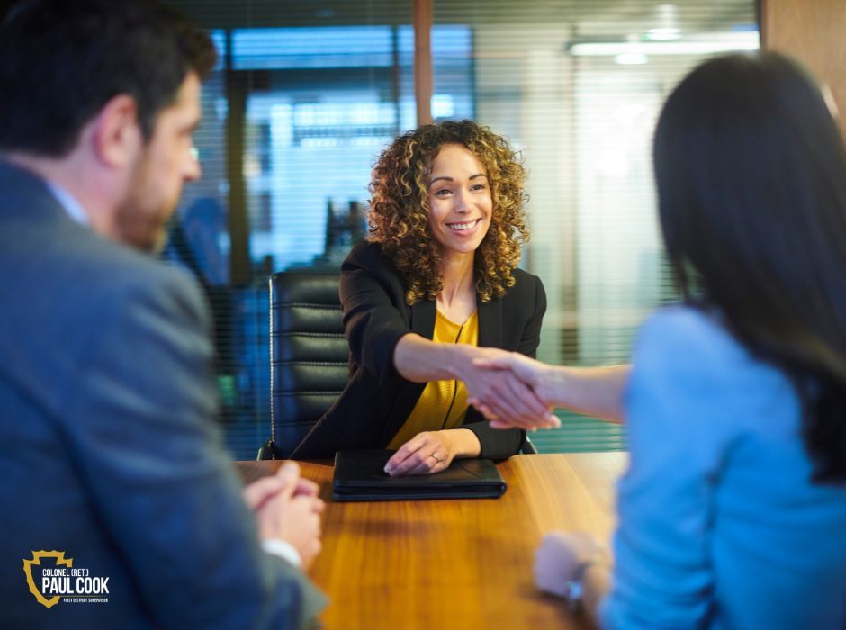 women shaking hands in a business setting